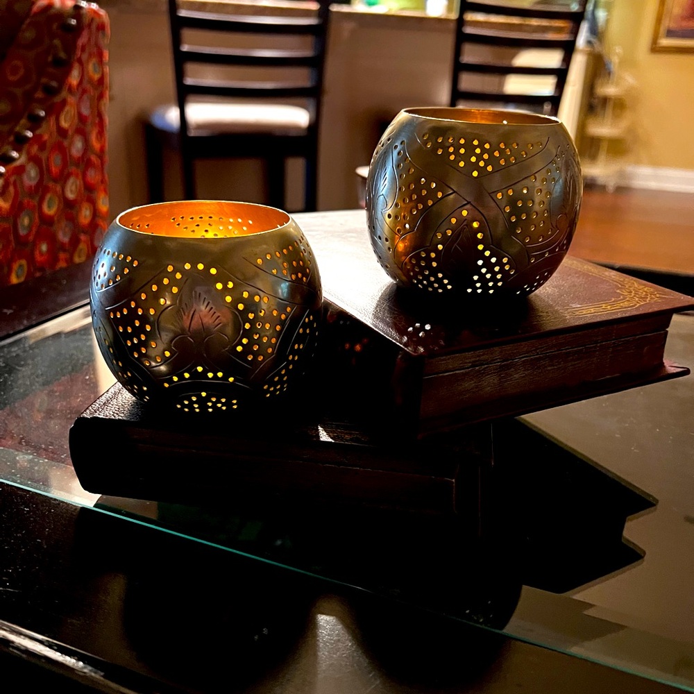 Two Pottery Barn stainless steel votives.